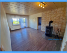 Wohnzimmer mit Kaminofen - Eigentumswohnung mit Balkon in Reppichau – 4 Zimmer Küche Bad – mit Einbauküche